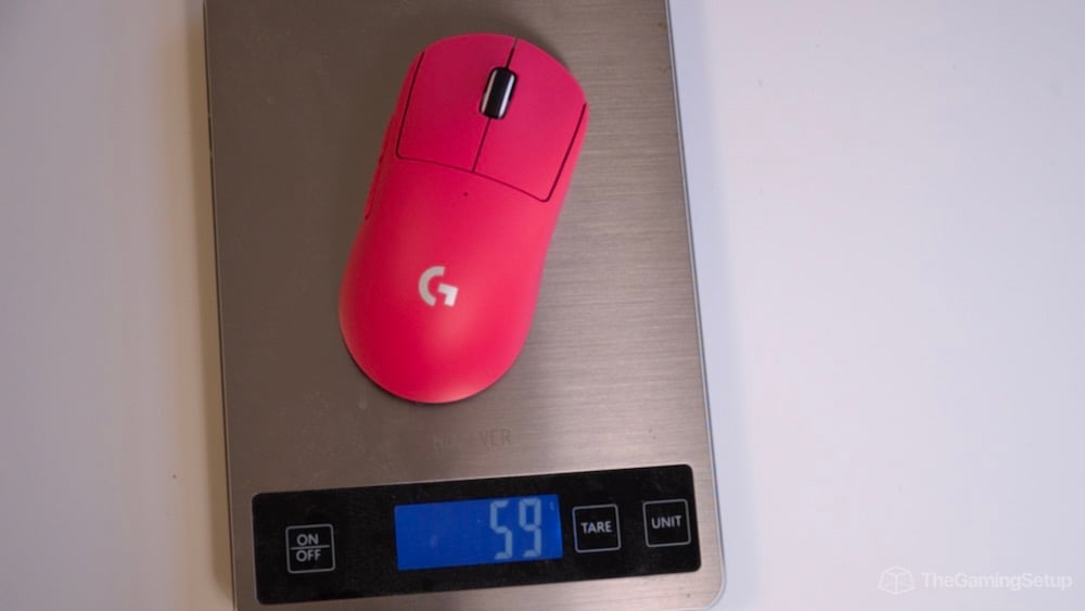 Logitech Superlight 2 on a scale at 59g